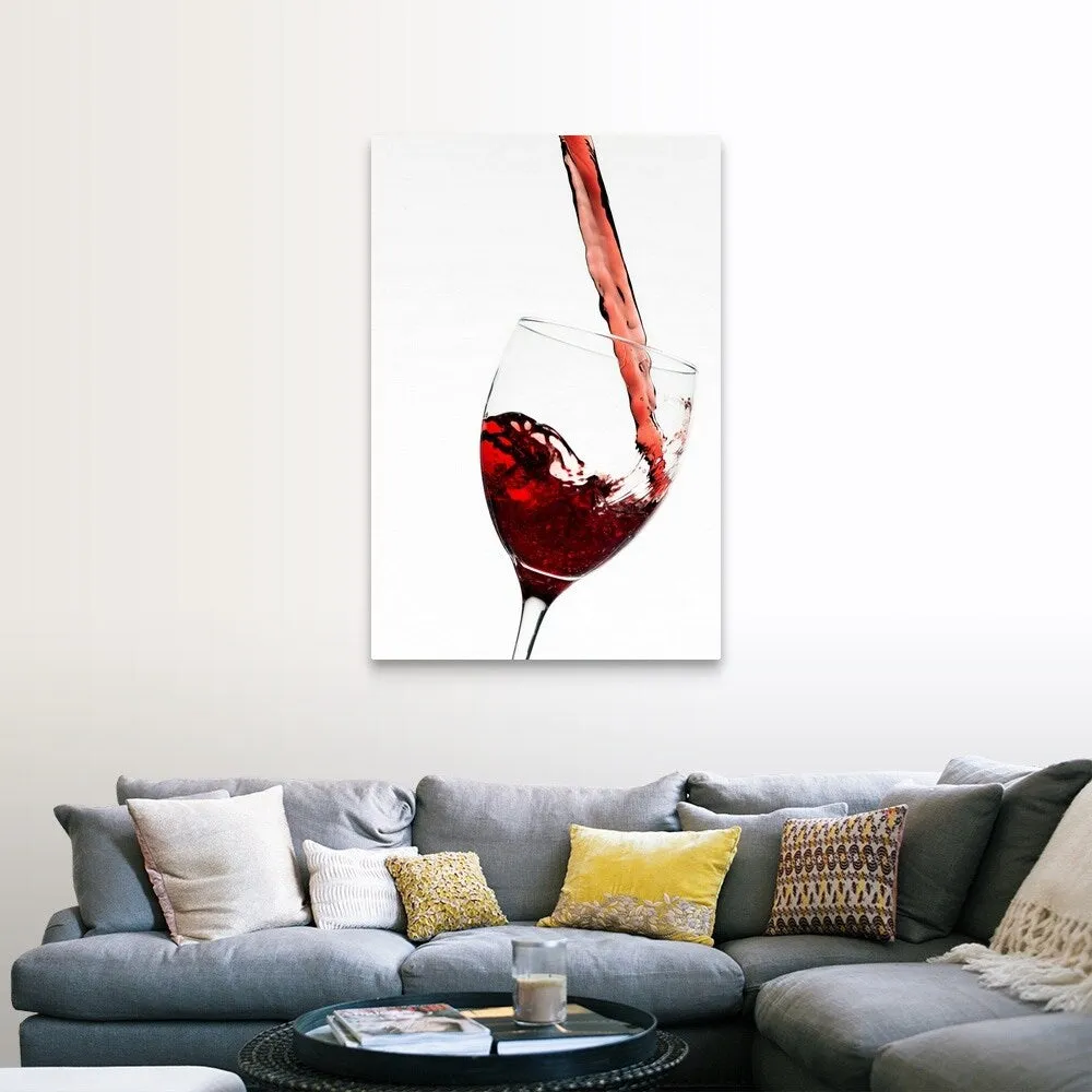 "Close up of red wine being poured into glass on white background" Canvas Wall Art