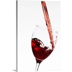 "Close up of red wine being poured into glass on white background" Canvas Wall Art