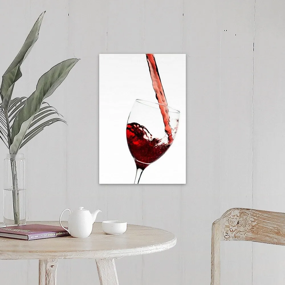 "Close up of red wine being poured into glass on white background" Canvas Wall Art